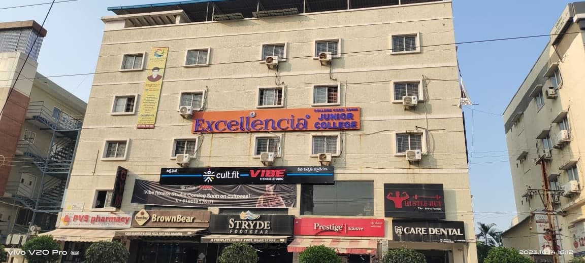 Excellencia Junior College building facade with ground-floor retail units and upper-floor classrooms